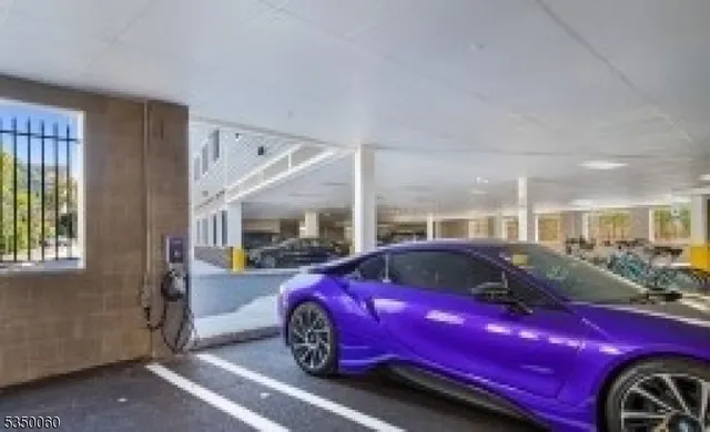 a front view of a house with parking space