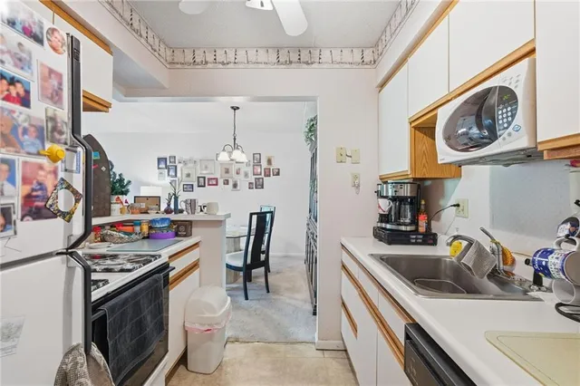 a bedroom with a bed furniture and painting on the wall