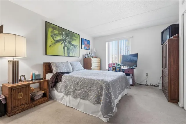 a bathroom with a sink toilet and shower curtain