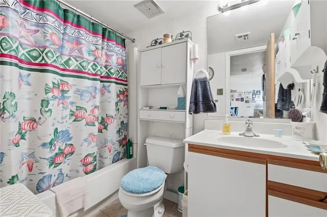 a view of a chair and table in the backyard