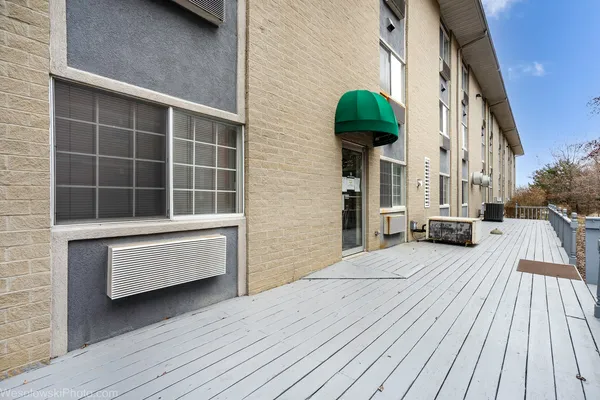 a view of front door with outdoor seating