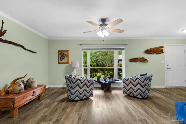 a living room with furniture and a large window