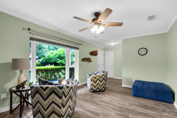 a living room with furniture and a large window