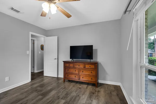 a view of room with wooden floor and window