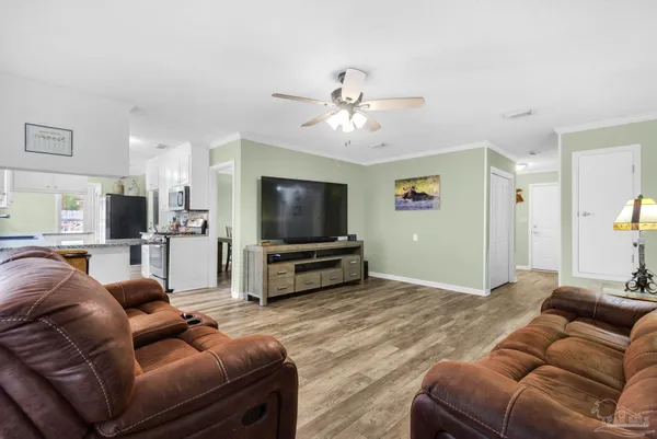 a living room with furniture and a flat screen tv