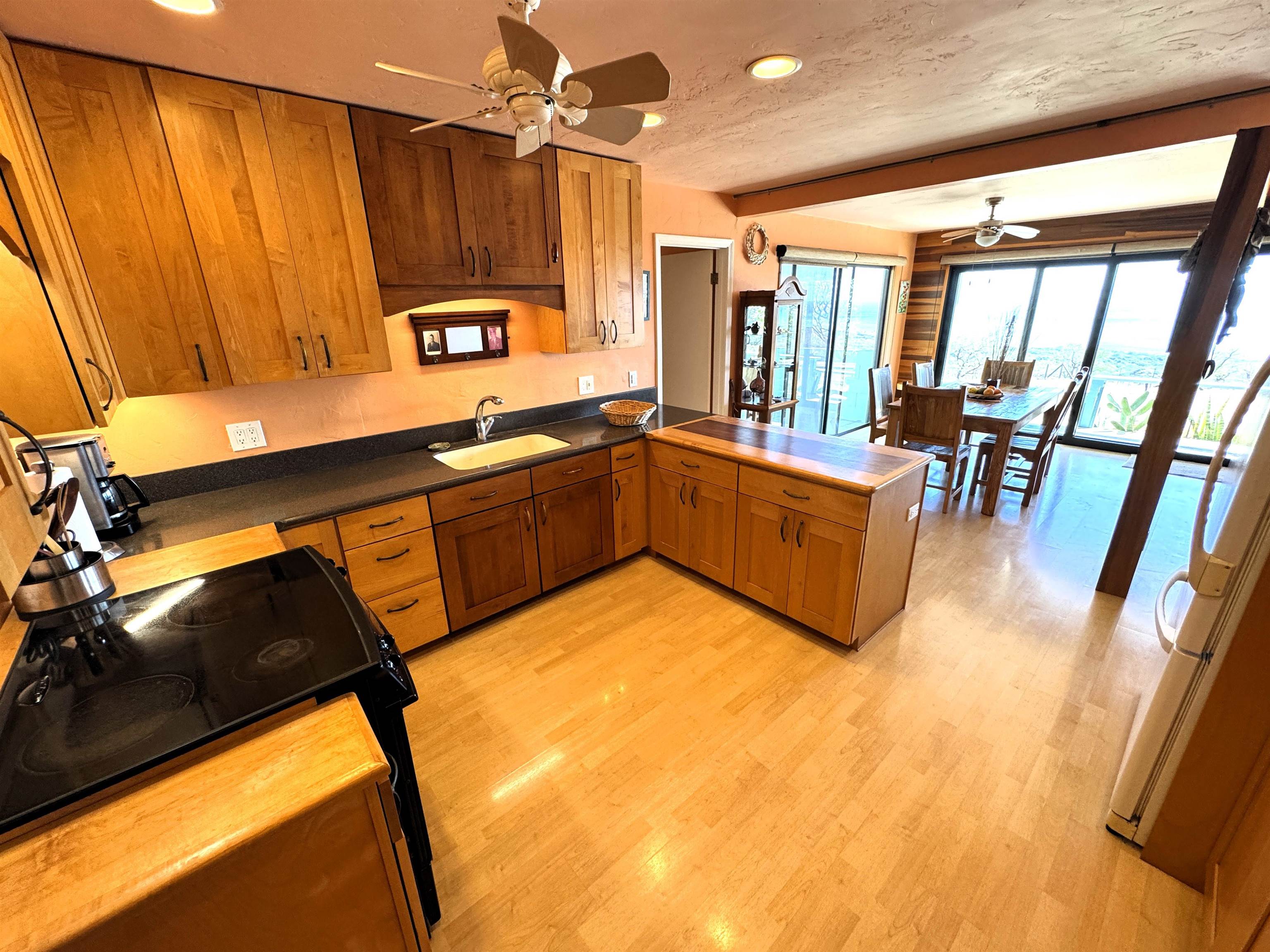 380 Ulua Road, Unit LOT 171 Kaunakakai, HI 96748 - Photo 13 of 44 a kitchen with a sink appliances and cabinets