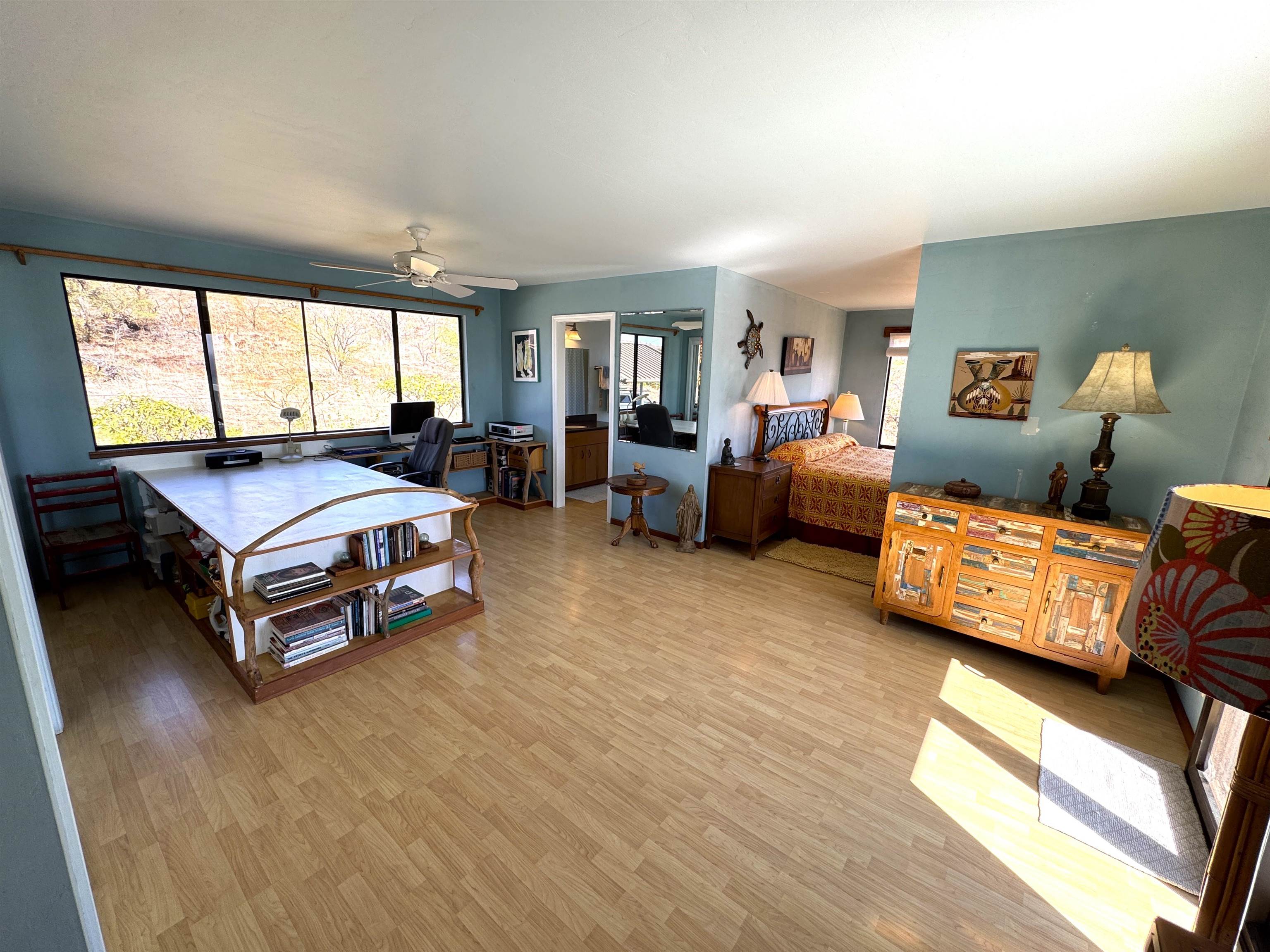 380 Ulua Road, Unit LOT 171 Kaunakakai, HI 96748 - Photo 22 of 44 a spacious bedroom with a bed and a couch