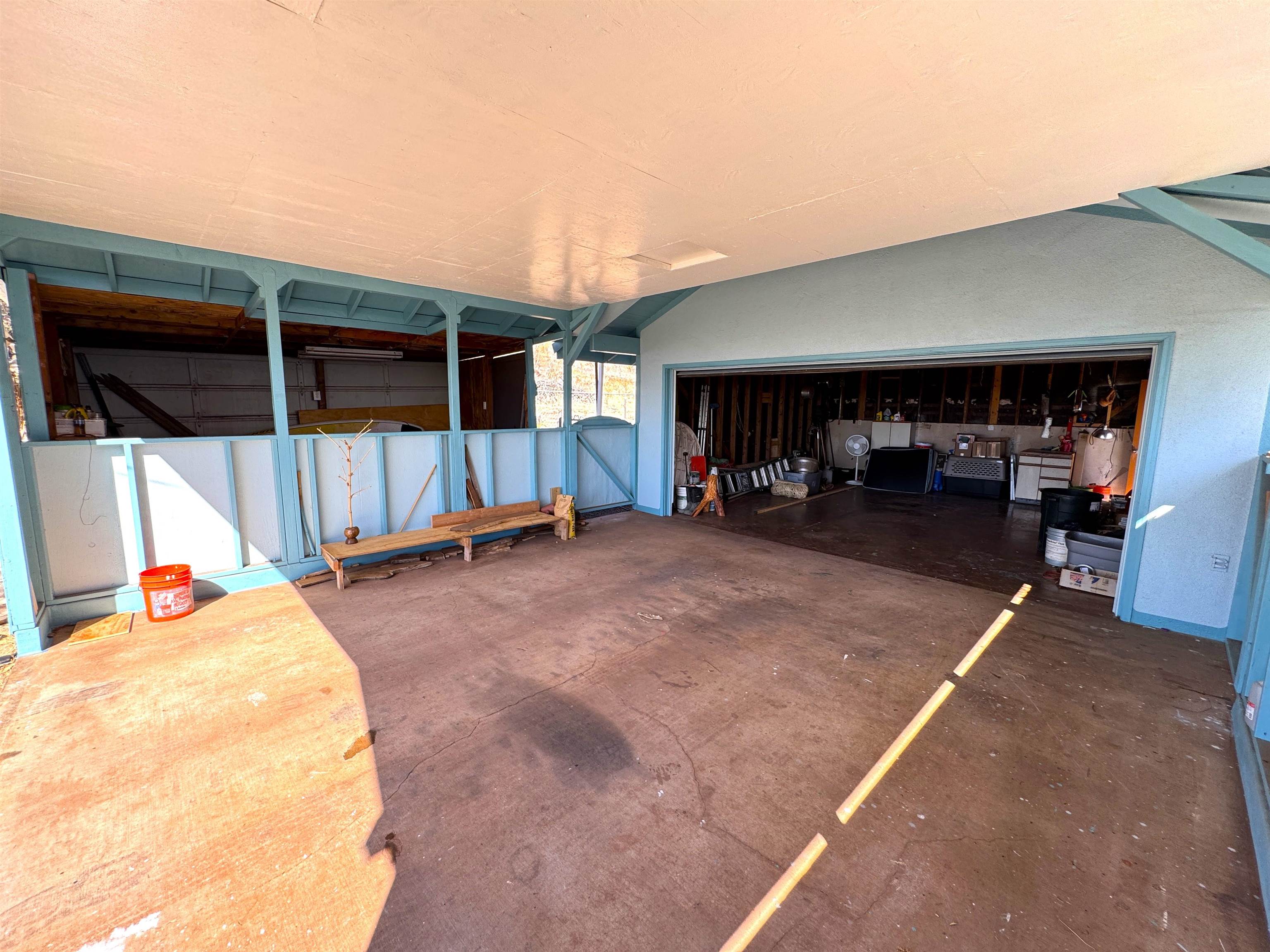 380 Ulua Road, Unit LOT 171 Kaunakakai, HI 96748 - Photo 32 of 44 a view of a porch with furniture and a garage