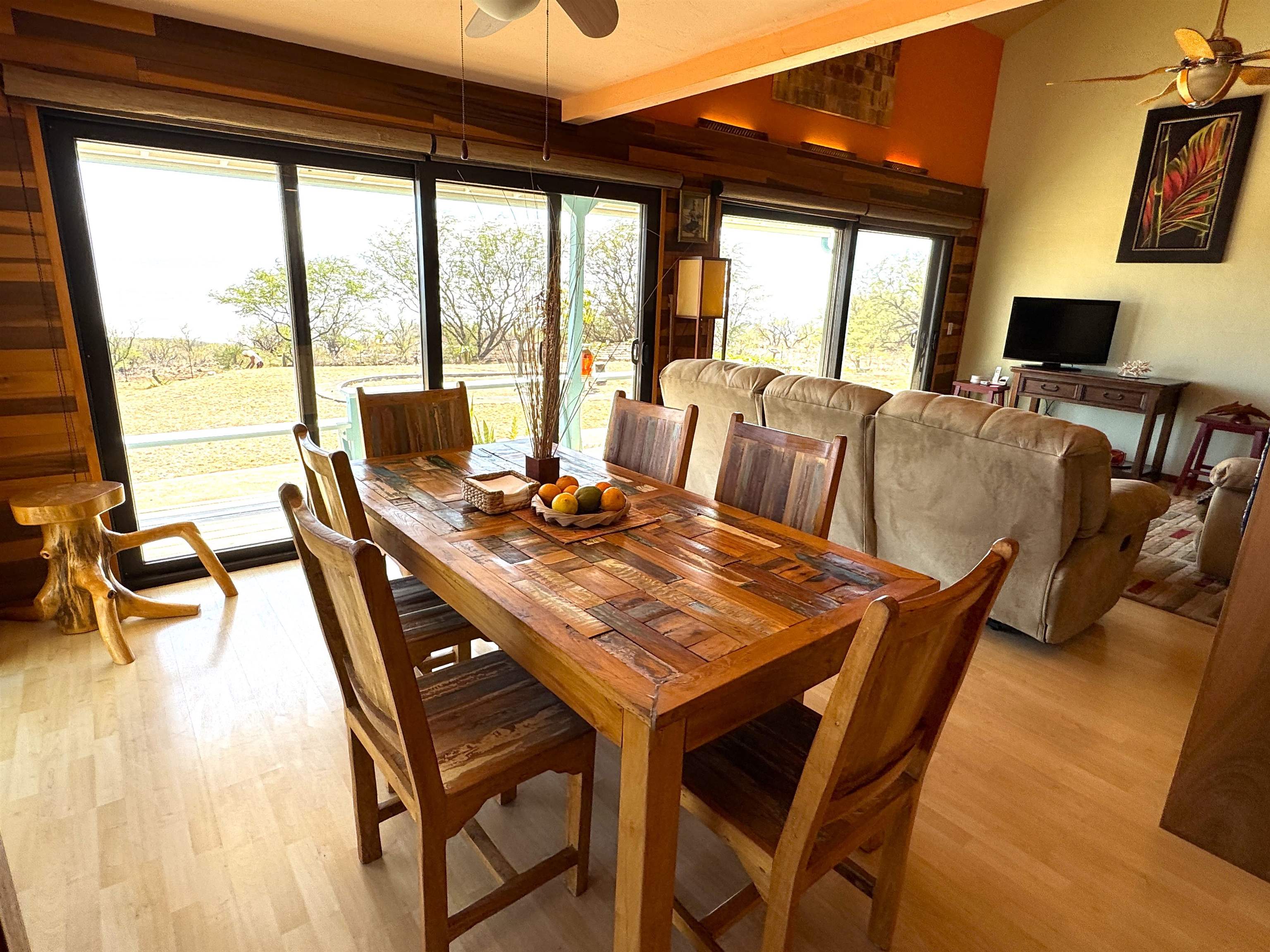 380 Ulua Road, Unit LOT 171 Kaunakakai, HI 96748 - Photo 8 of 44 a view of a dining room with furniture large windows and wooden floor