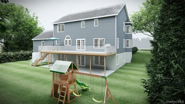 a front view of a house with a yard table and chairs