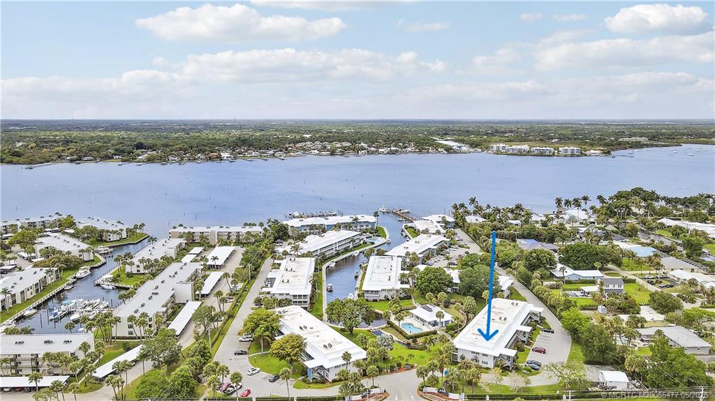 1852 Southwest Palm City Road, Unit 201 Stuart, FL 34994 - Photo 26 of 34 an aerial view of a city with lots of residential buildings