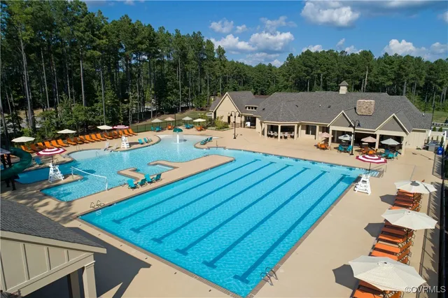 an aerial view of a house with swimming pool patio and mountain view