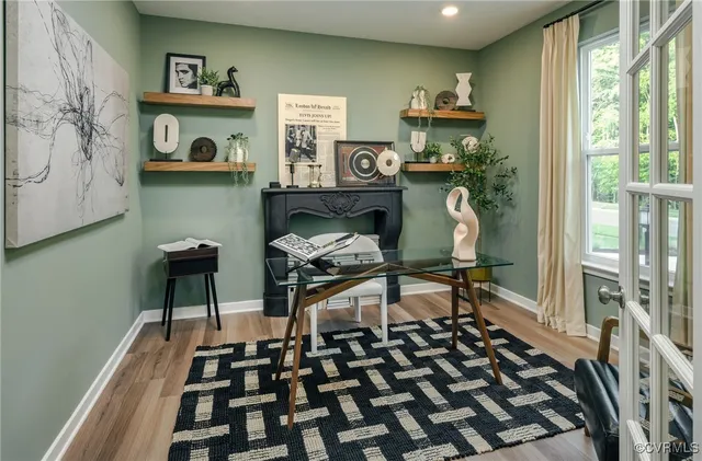 a bedroom with furniture and a window