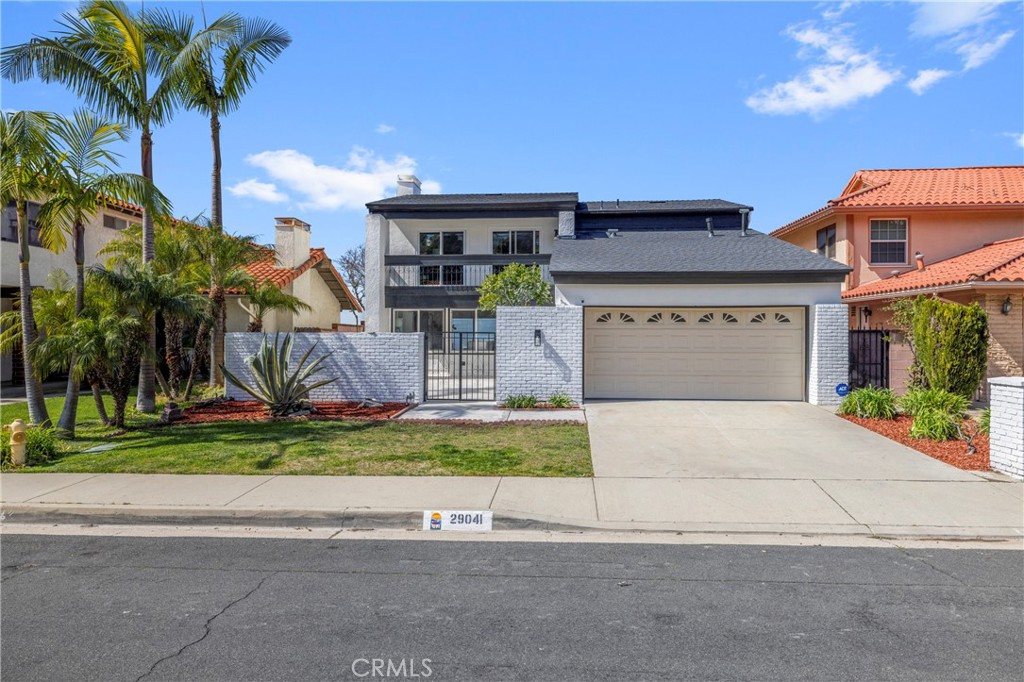 29041 Warnick Road Rancho Palos Verdes, CA 90275 - Photo 1 of 1 a front view of a house with garden