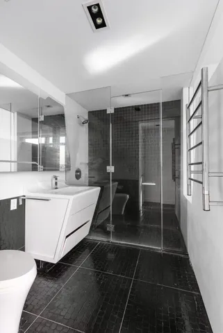 a bedroom with a bed and a potted plant