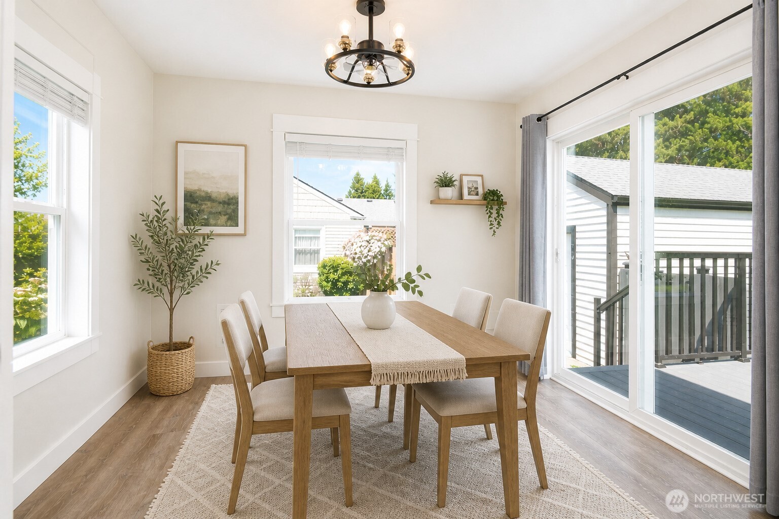 6919 Cady Road Everett, WA 98203 - Photo 11 of 19 a view of a dining room with furniture window and wooden floor