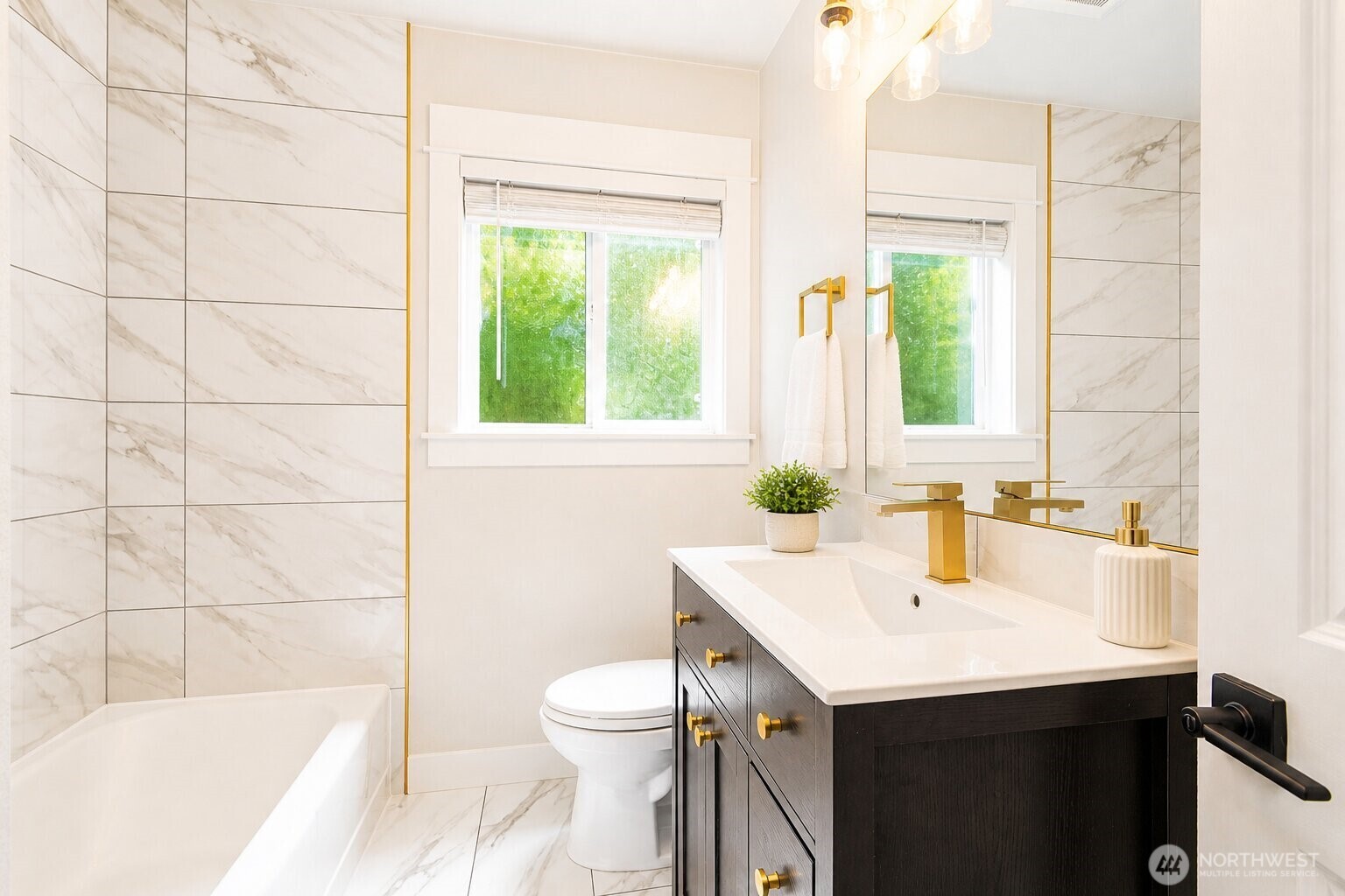 6919 Cady Road Everett, WA 98203 - Photo 5 of 19 a bathroom with a sink a toilet and tub