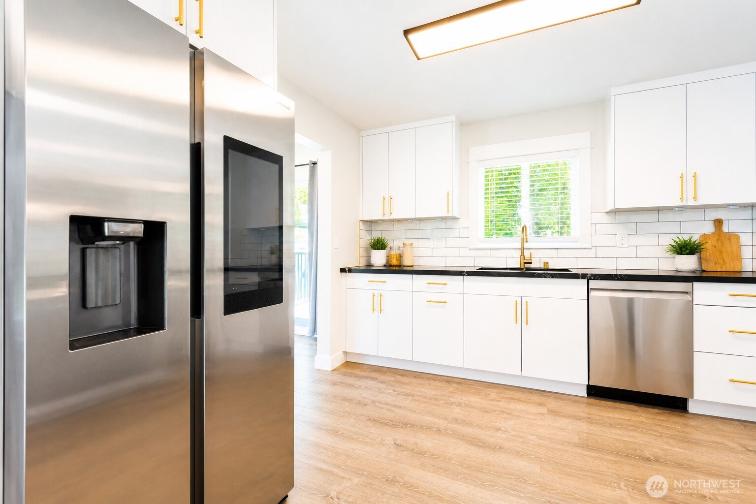 6919 Cady Road Everett, WA 98203 - Photo 10 of 19 a kitchen with stainless steel appliances granite countertop a refrigerator and a sink