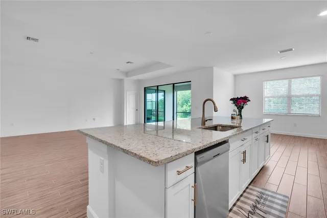a kitchen with a sink and cabinets