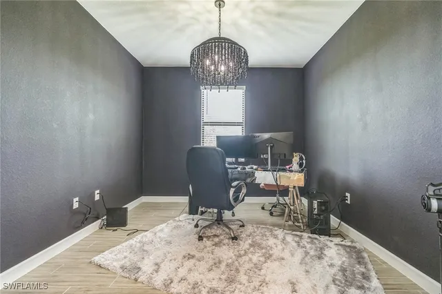 a workspace with furniture and window