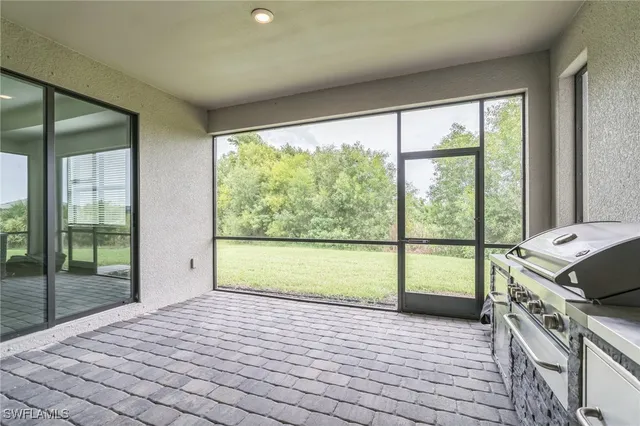 a bedroom with a large window
