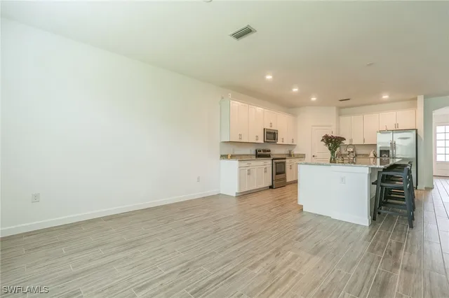 a view of kitchen with wooden floor