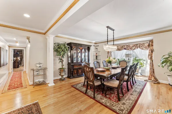 a view of a dining room with furniture window and wooden floor
