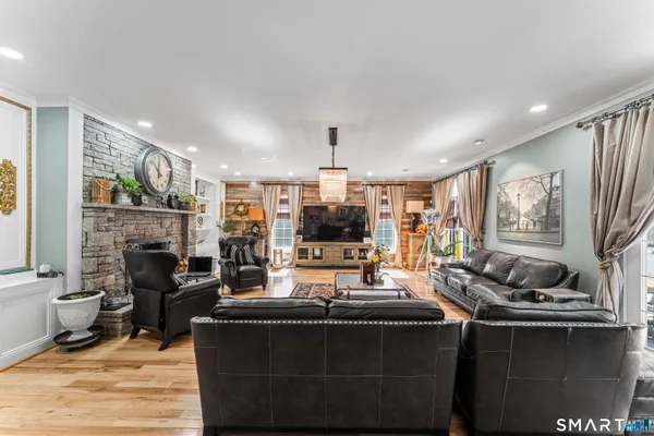 a living room with fireplace furniture and a fireplace