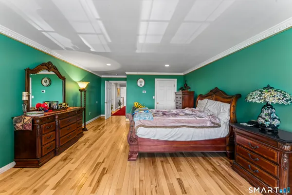 a bed room with furniture and a dresser