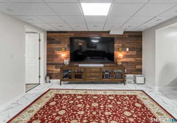 a room with furniture and a rug