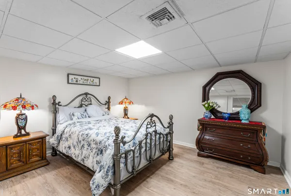 a bedroom with a bed and a dresser