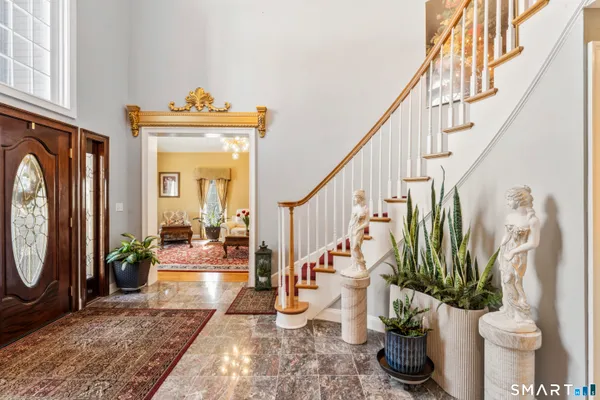 a view of an entryway with wooden floor