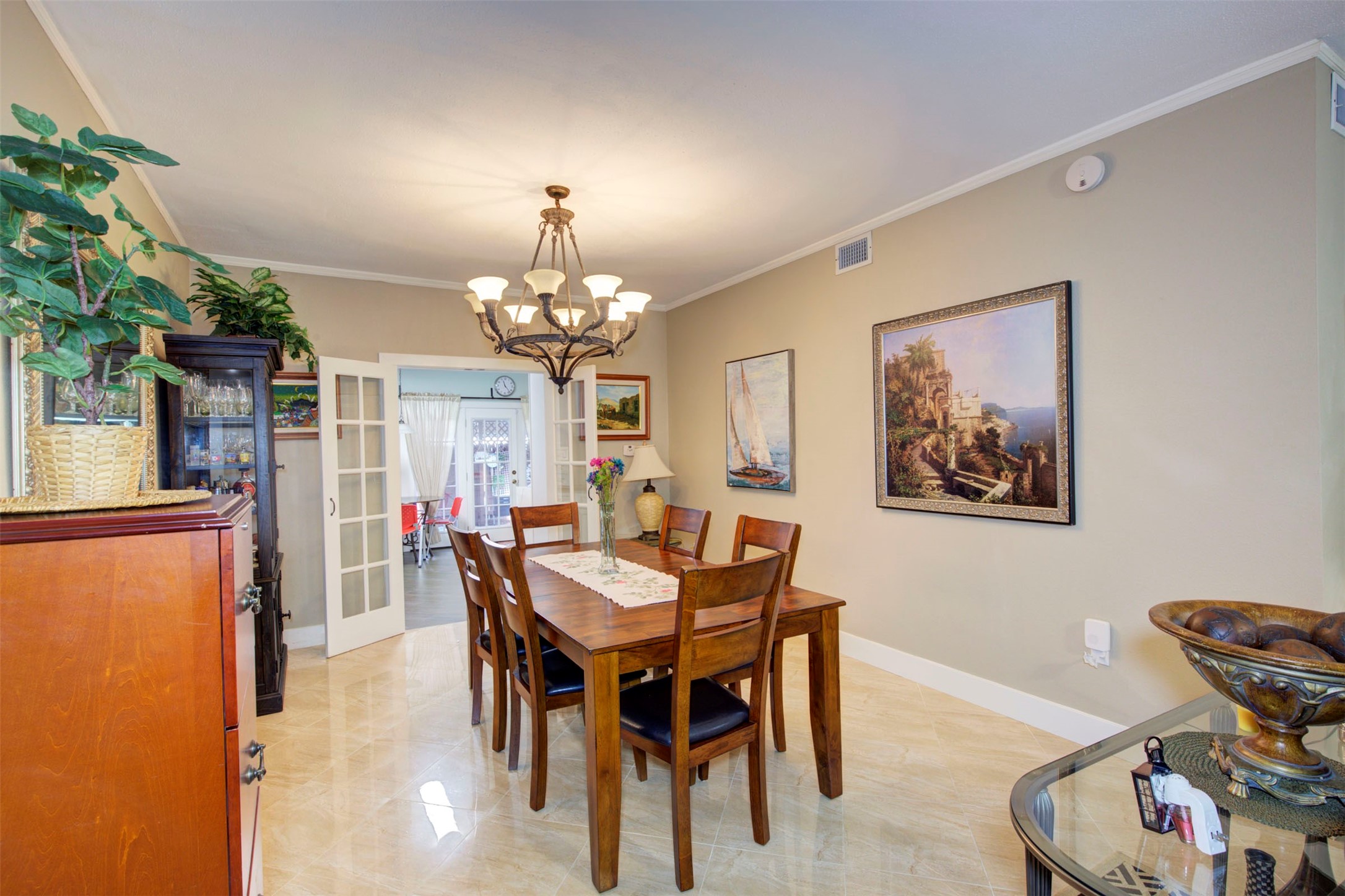 840 Threadneedle Street, Unit 208 Houston, TX 77079 - Photo 13 of 31 a view of a dining room with furniture and chandelier