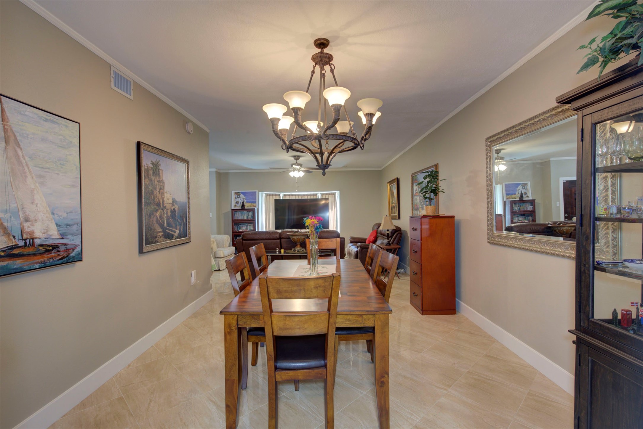 840 Threadneedle Street, Unit 208 Houston, TX 77079 - Photo 15 of 31 a view of a dining room with furniture and a chandelier