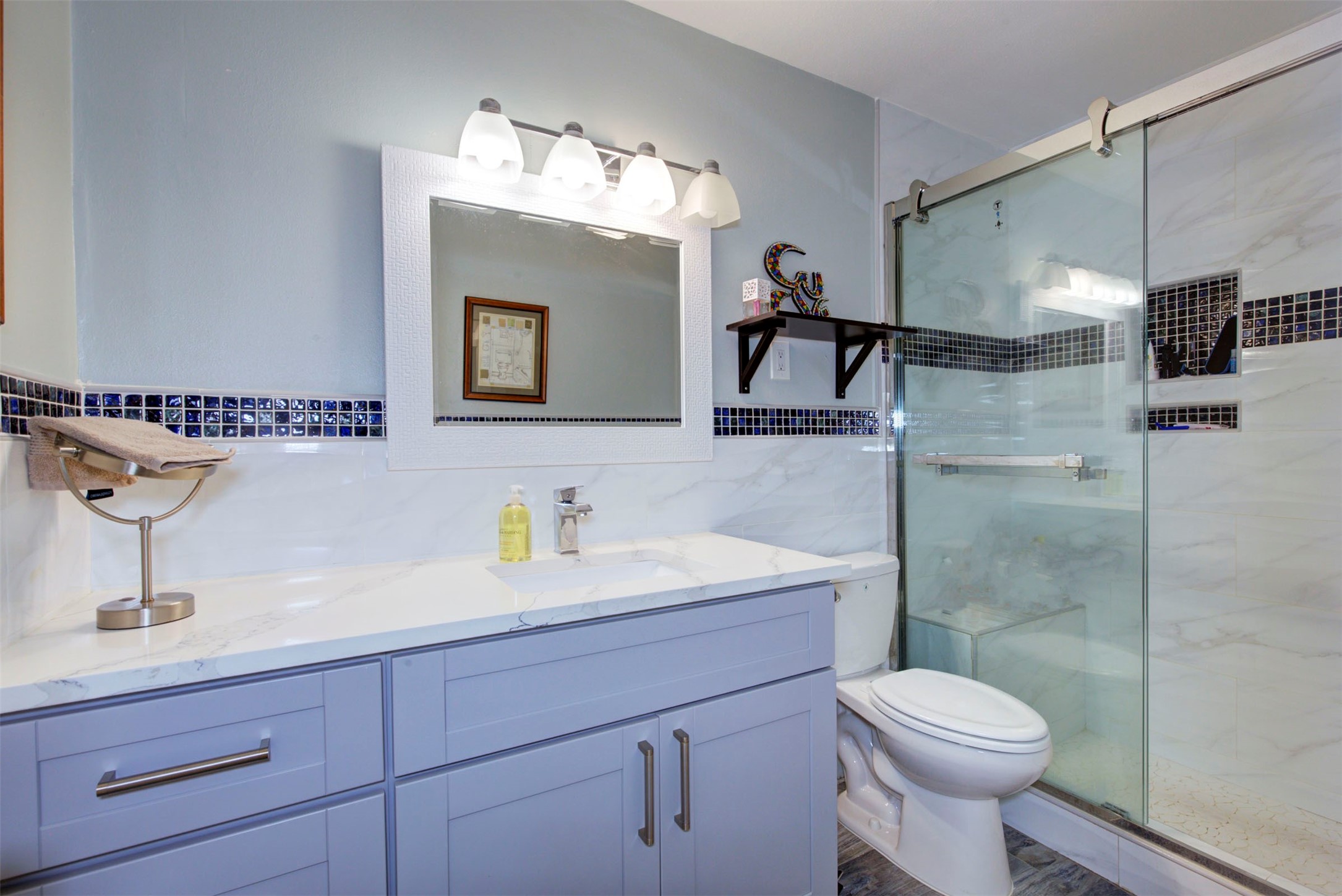 840 Threadneedle Street, Unit 208 Houston, TX 77079 - Photo 21 of 31 a bathroom with a sink a toilet and shower