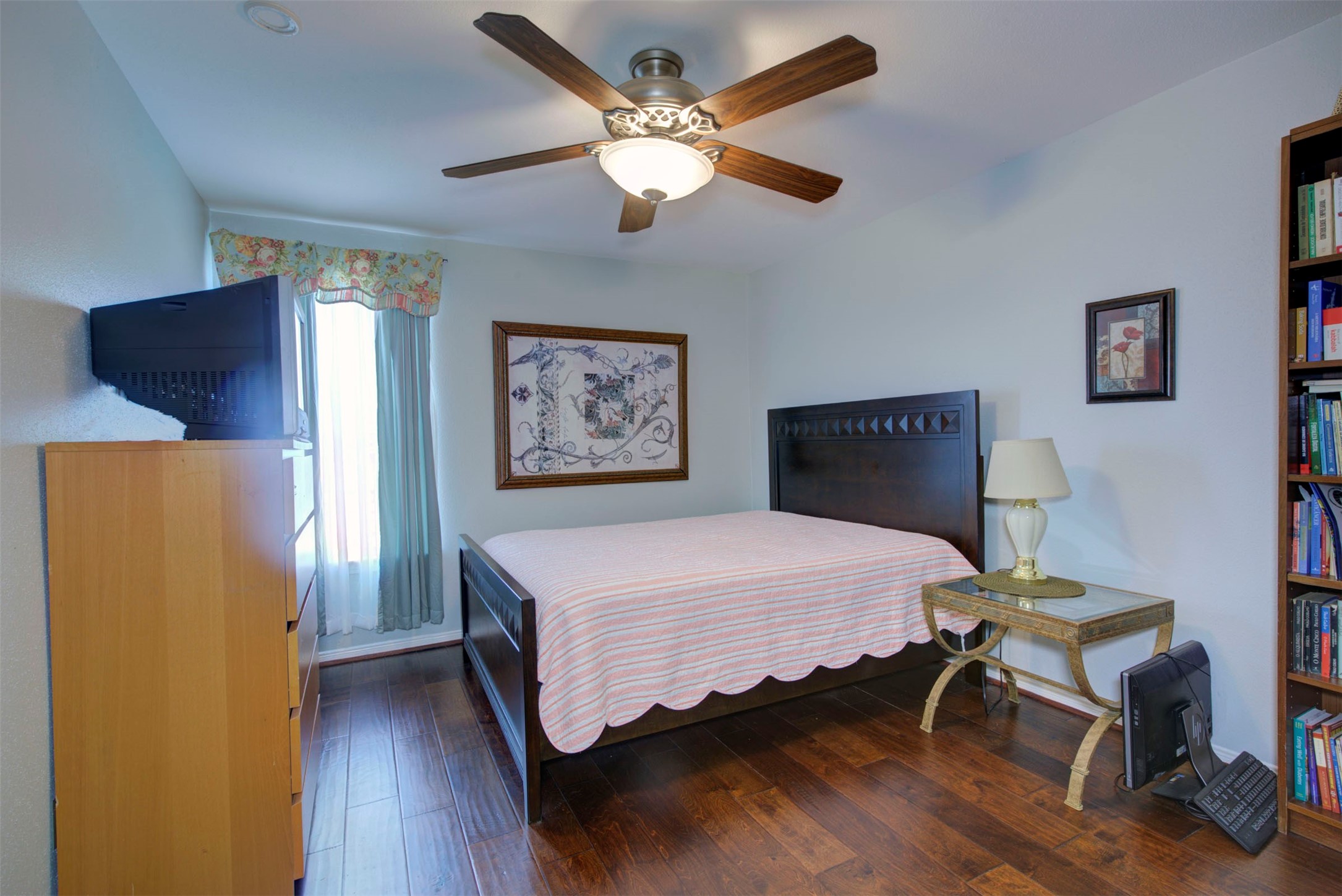 840 Threadneedle Street, Unit 208 Houston, TX 77079 - Photo 23 of 31 a bedroom with a bed and a chandelier