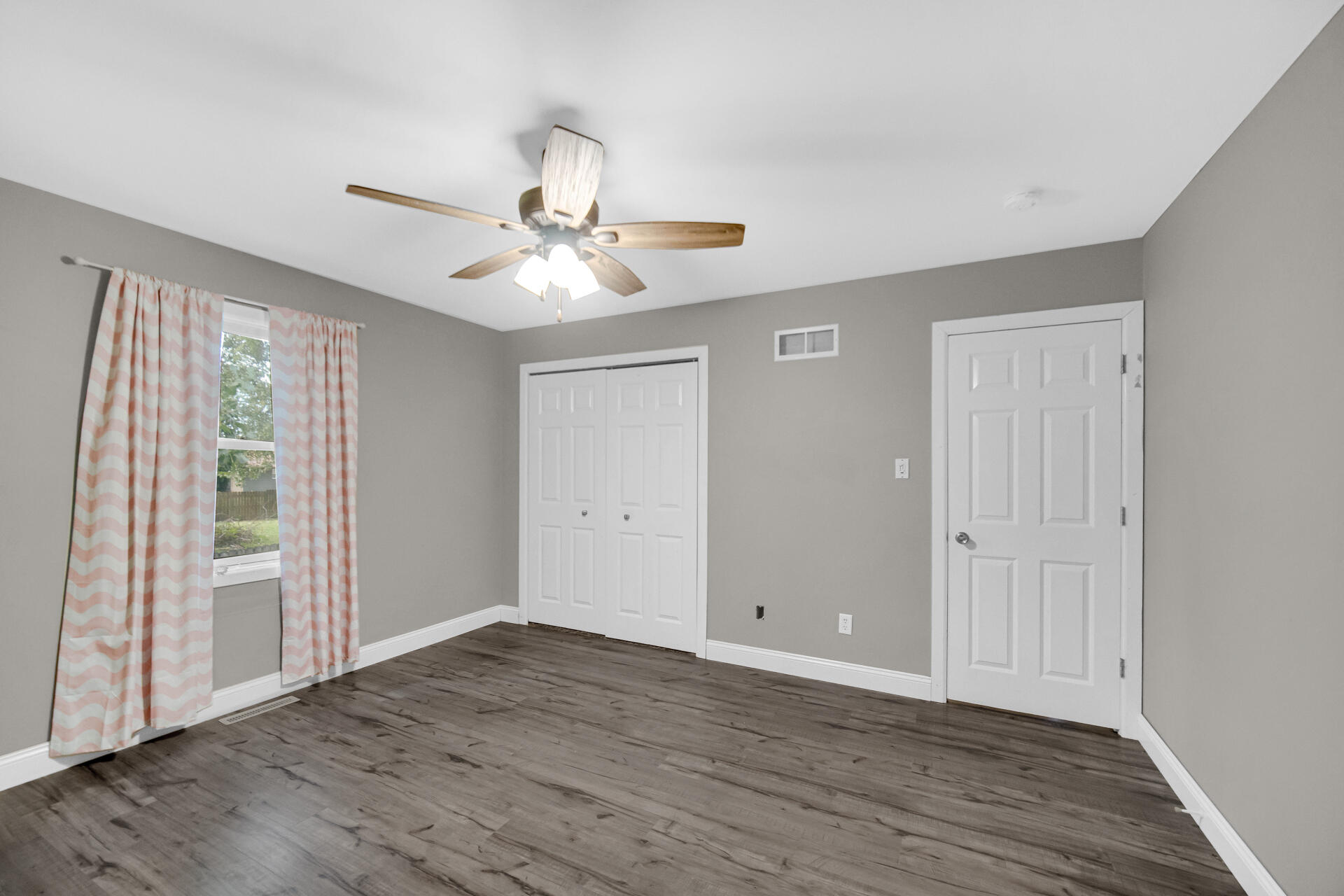 3716 Walsh Street Portage, IN 46368 - Photo 13 of 24 wooden floor in an empty room with a window