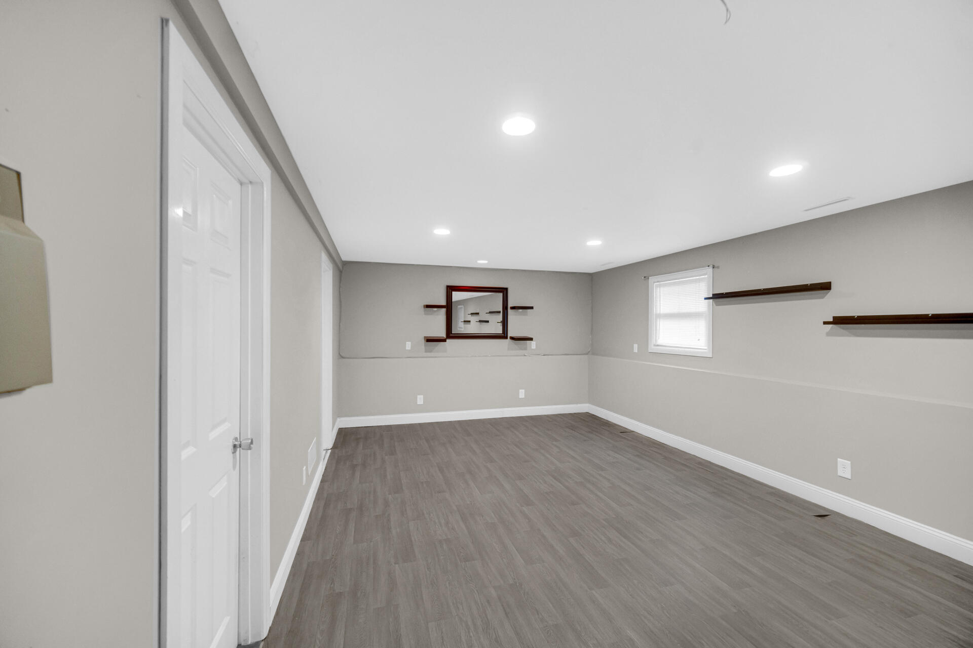 3716 Walsh Street Portage, IN 46368 - Photo 14 of 24 a view of a big room with wooden floor and windows
