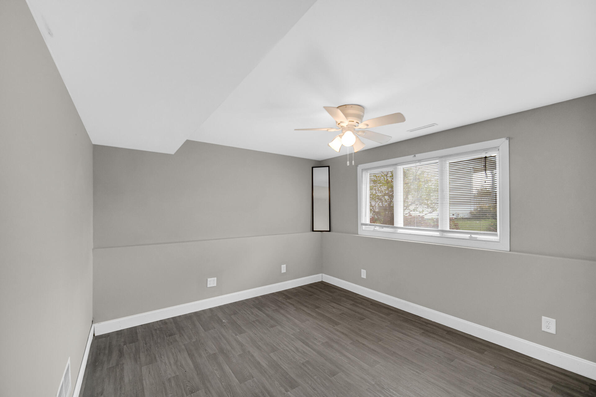 3716 Walsh Street Portage, IN 46368 - Photo 18 of 24 a view of an empty room with wooden floor and a window