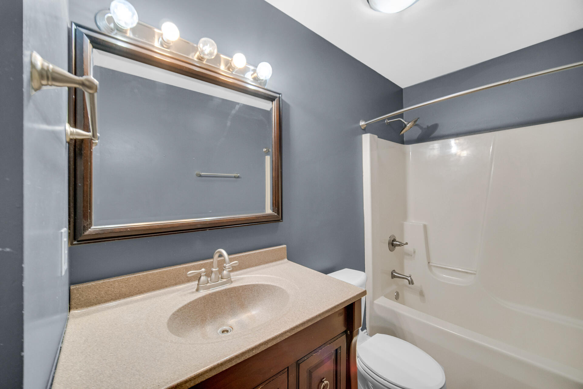 3716 Walsh Street Portage, IN 46368 - Photo 7 of 24 a bathroom with a sink toilet and shower