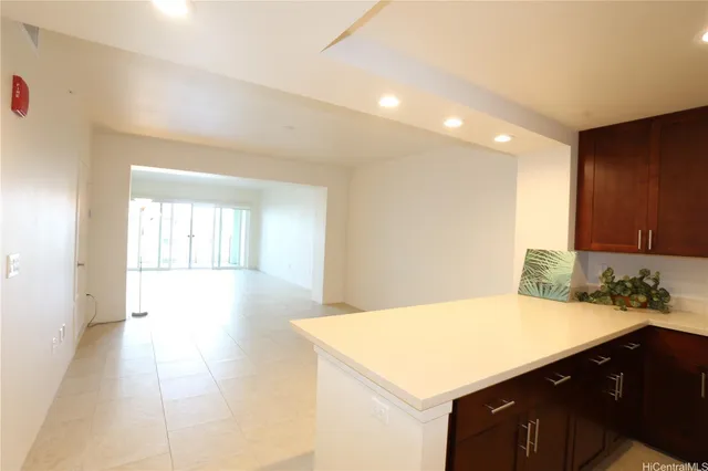 a kitchen with a sink a stove and cabinets