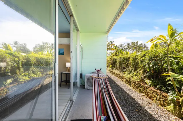 a balcony with view of outdoor space