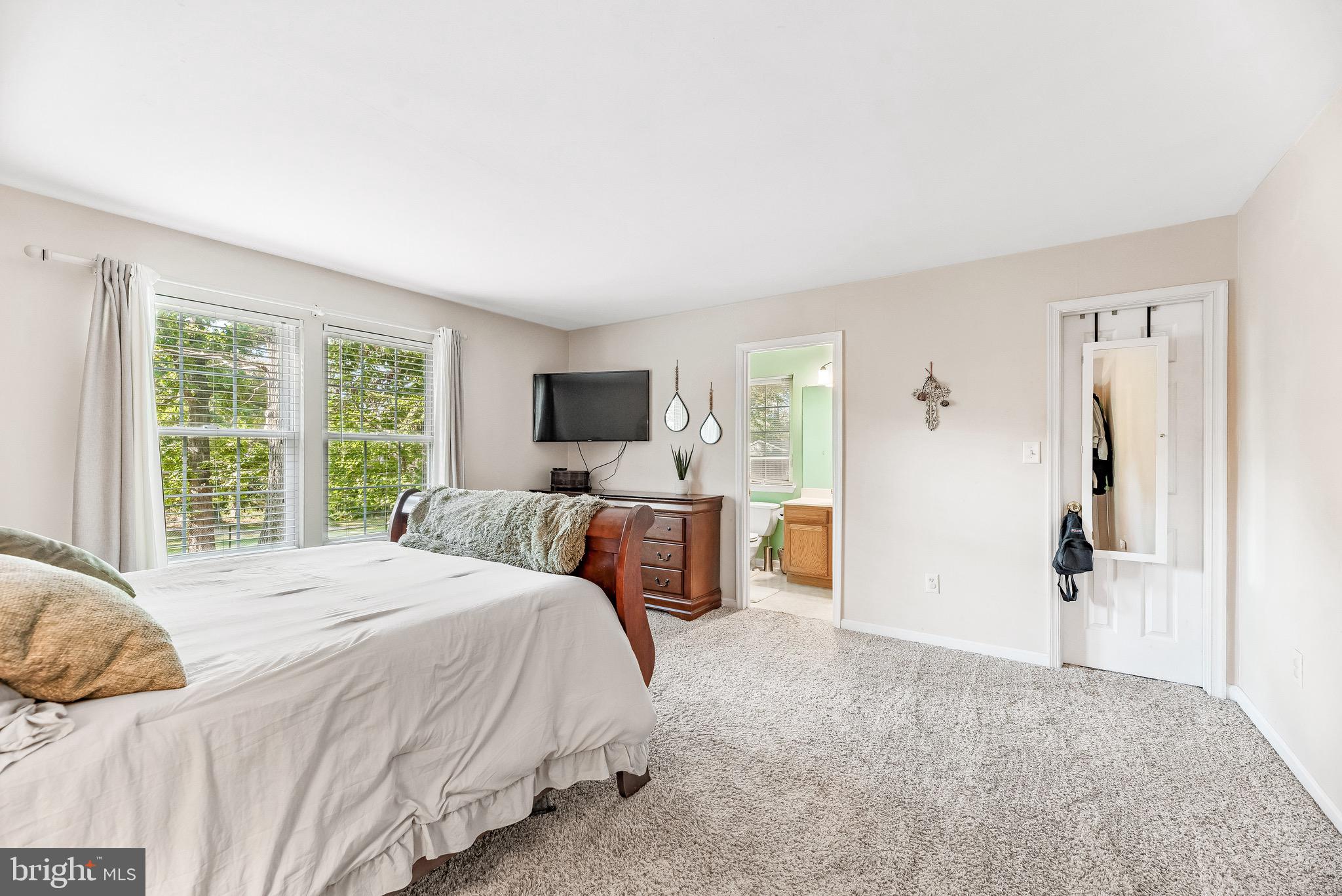 11156 Rawhide Road Lusby, MD 20657 - Photo 17 of 33 a bedroom with a bed and large window