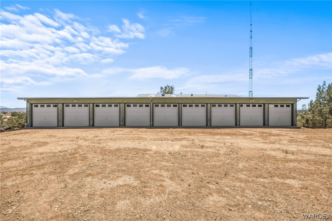 2401 North Stephan Road Kingman, AZ 86401 - Photo 18 of 92 Multi-bay garage structure featuring eight individual bays with white paneled garage doors