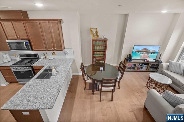54 Arnold Drive Wood-Ridge, NJ 07075 - Photo 7 of 40 a living room with furniture and a wooden floor
