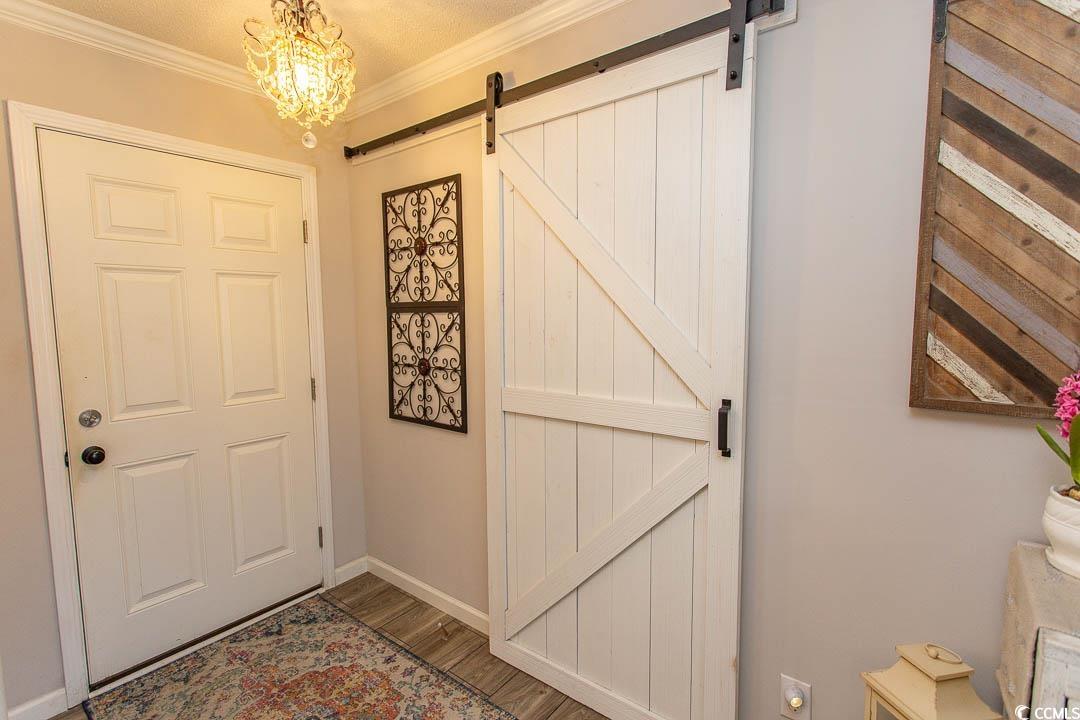 1664 Greenridge Drive Conway, SC 29526 - Photo 12 of 40 Doorway to Den with wood finished floors, a barn d