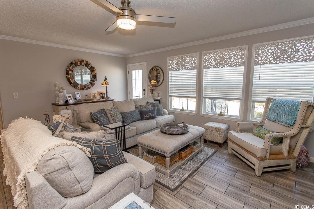 1664 Greenridge Drive Conway, SC 29526 - Photo 19 of 40 Living room with ornamental molding, light wood fi