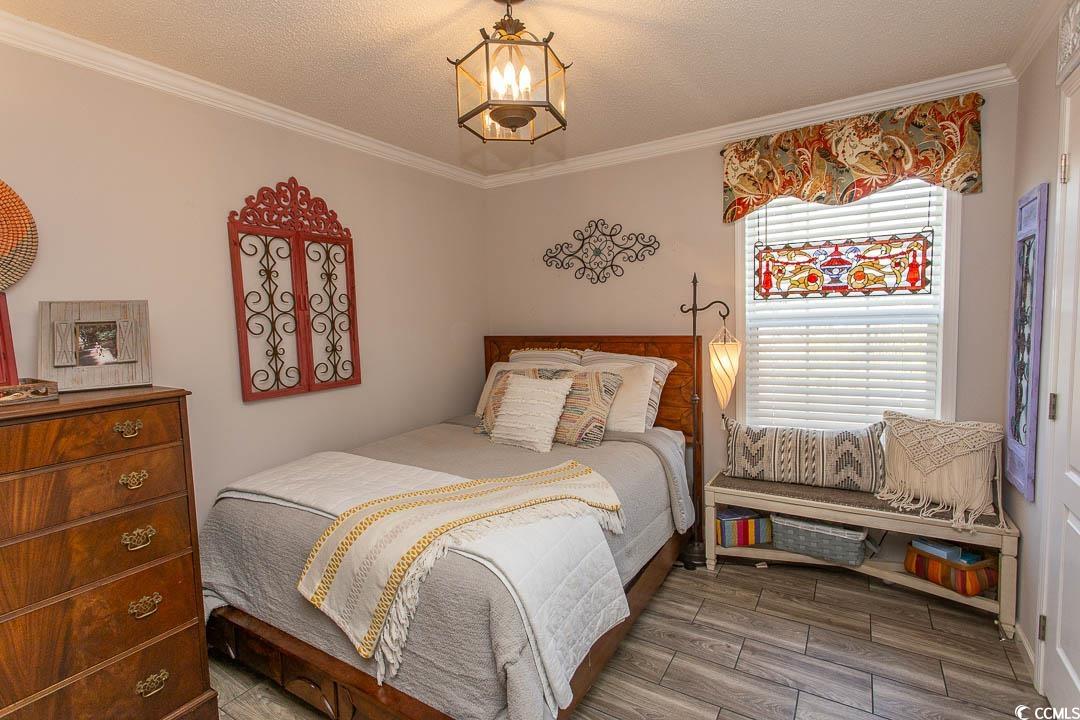 1664 Greenridge Drive Conway, SC 29526 - Photo 23 of 40 Bedroom featuring wood finished floors, a textured