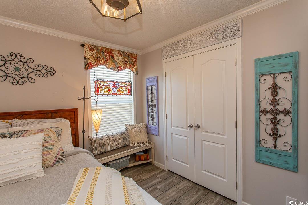 1664 Greenridge Drive Conway, SC 29526 - Photo 24 of 40 Bedroom with a textured ceiling, crown molding, ba
