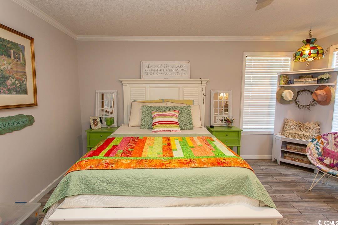 1664 Greenridge Drive Conway, SC 29526 - Photo 26 of 40 Bedroom with ornamental molding, wood finished flo